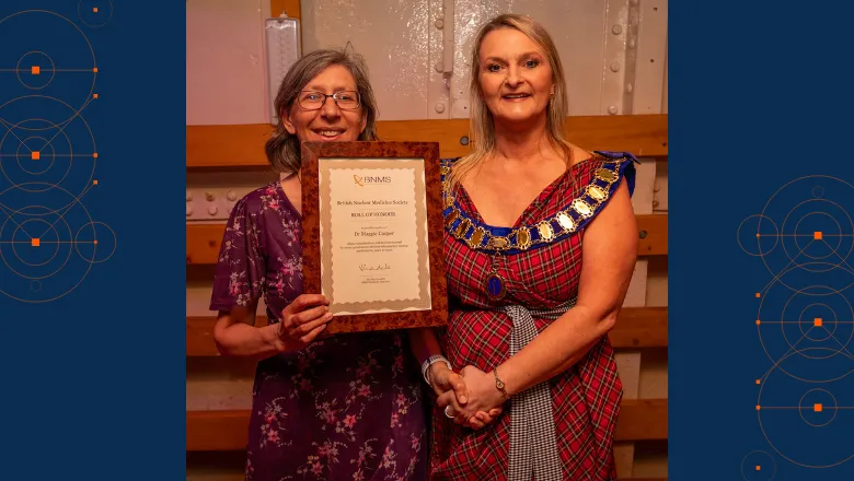 Maggie Cooper holding honour roll award