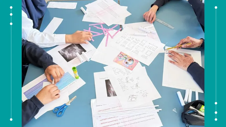 top view of school desk with students doing coursework