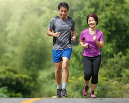 Middle aged couple running