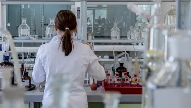Back of student working in a lab