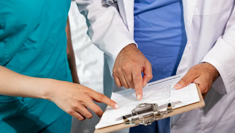Healthcare workers checking a report