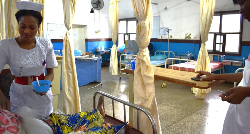 Nurses caring for patient on stroke unit Sierra Leone