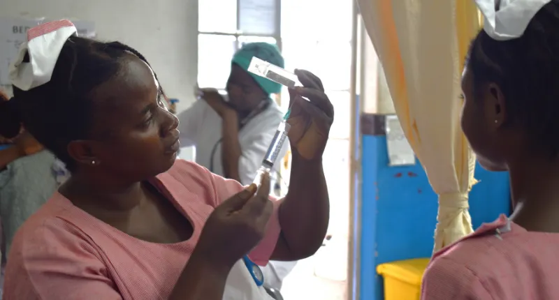 Nurses giving medication stroke ward Sierra Leone