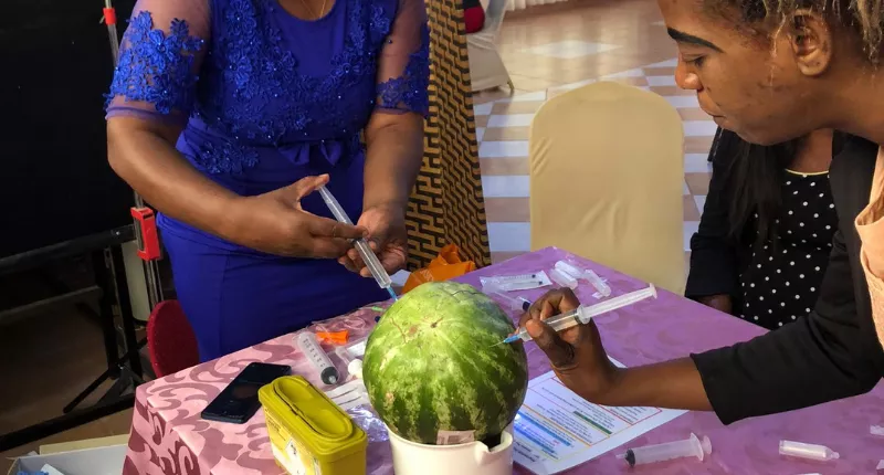 Zambia midwife training practicing on watermelon