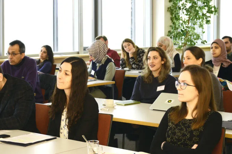 Students in a classroom listening to a lecture