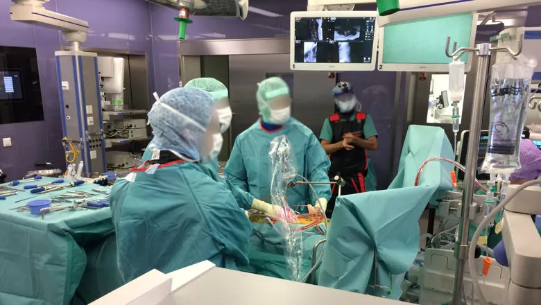 Surgeons using the device prototype.