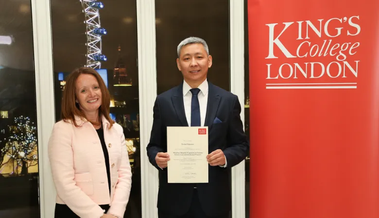 Mr Yerbol Ospanov, a participant on the programme and Director of the National Institute of Intellectual Property, receiving his certificate from Professor Nicki Cohen, the Dean of Educational Partnerships.