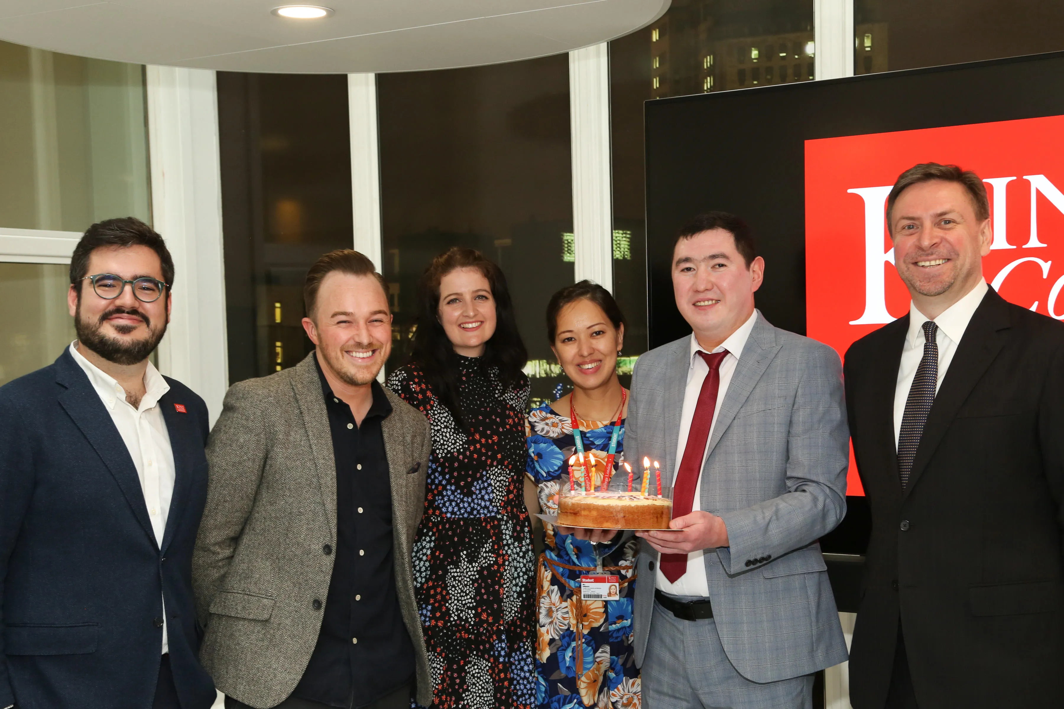 Scholars presenting a home-made cake to the programme staff and the Project Lead, Mr Yury Bikbaev (far right).