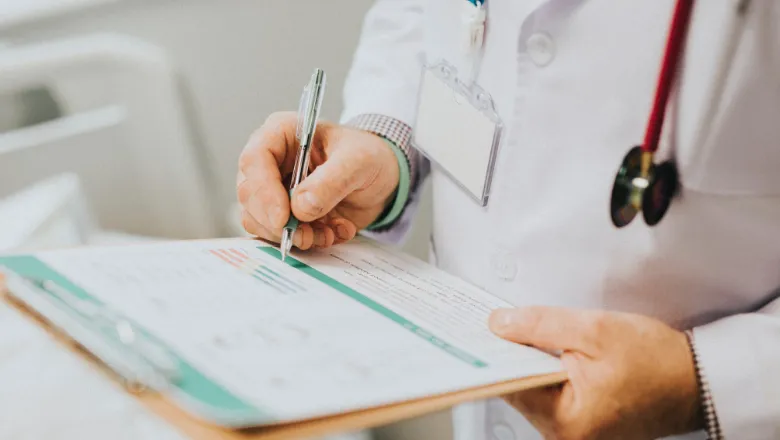 Close up of doctor with clipboard and stethoscope