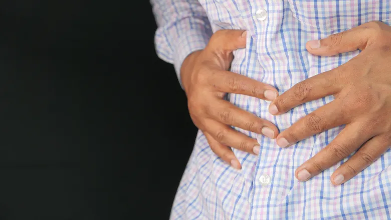 Someone holding their stomach