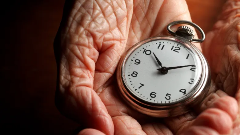 Image of ageing hands holding a watch