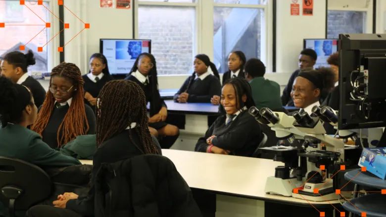 A group of students attending an insight session in a lab