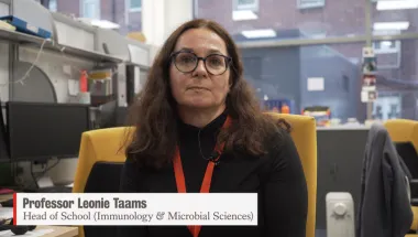 Image of Professor Leonie Taams sat at a desk