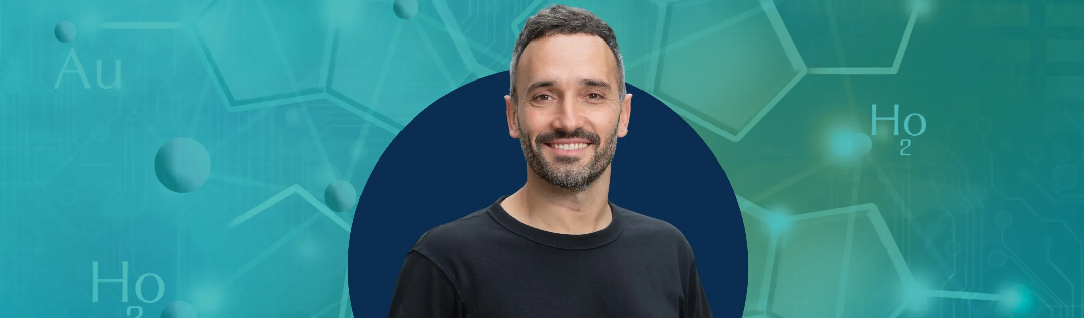 Man smiling in front of blue background