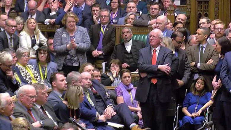 MP Tulip Siddiq sits in a wheelchair after the vote