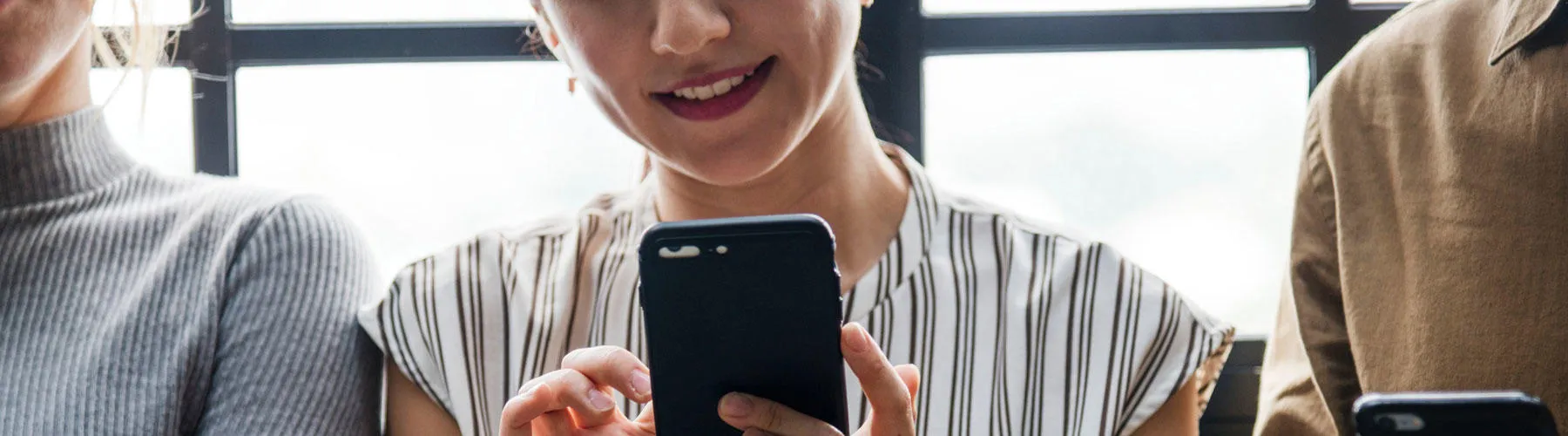Woman holding mobile phone
