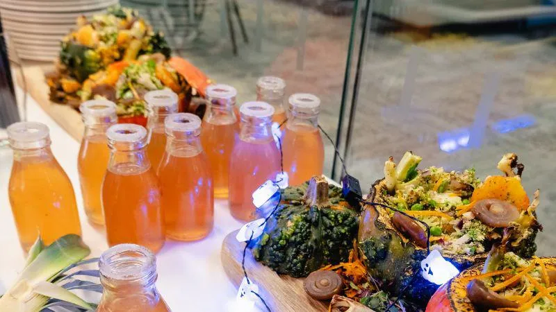 Small glass bottles filled with hibiscus pineapple drink