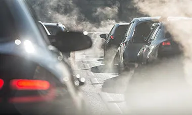 Cars on a polluted road.