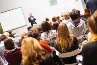 People listening at a workshop