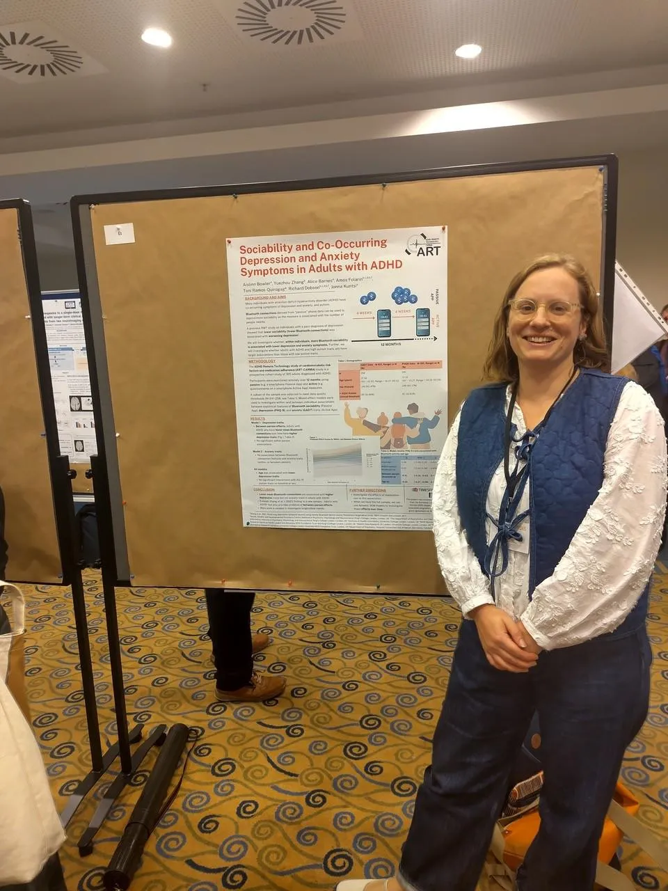 Aislinn standing Infront of the poster she was presenting at the conference