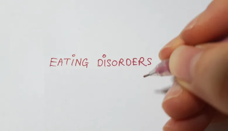 'eating disorders' written in red pen on paper
