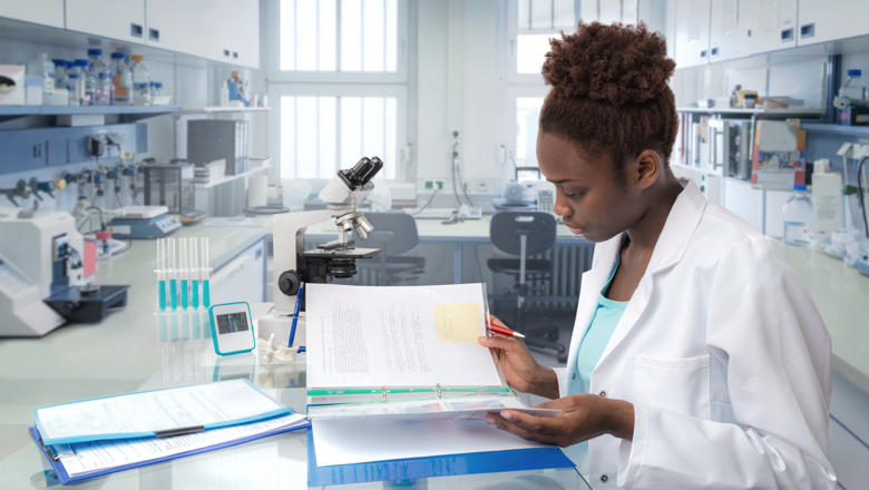 woman-reading-file-in-lab
