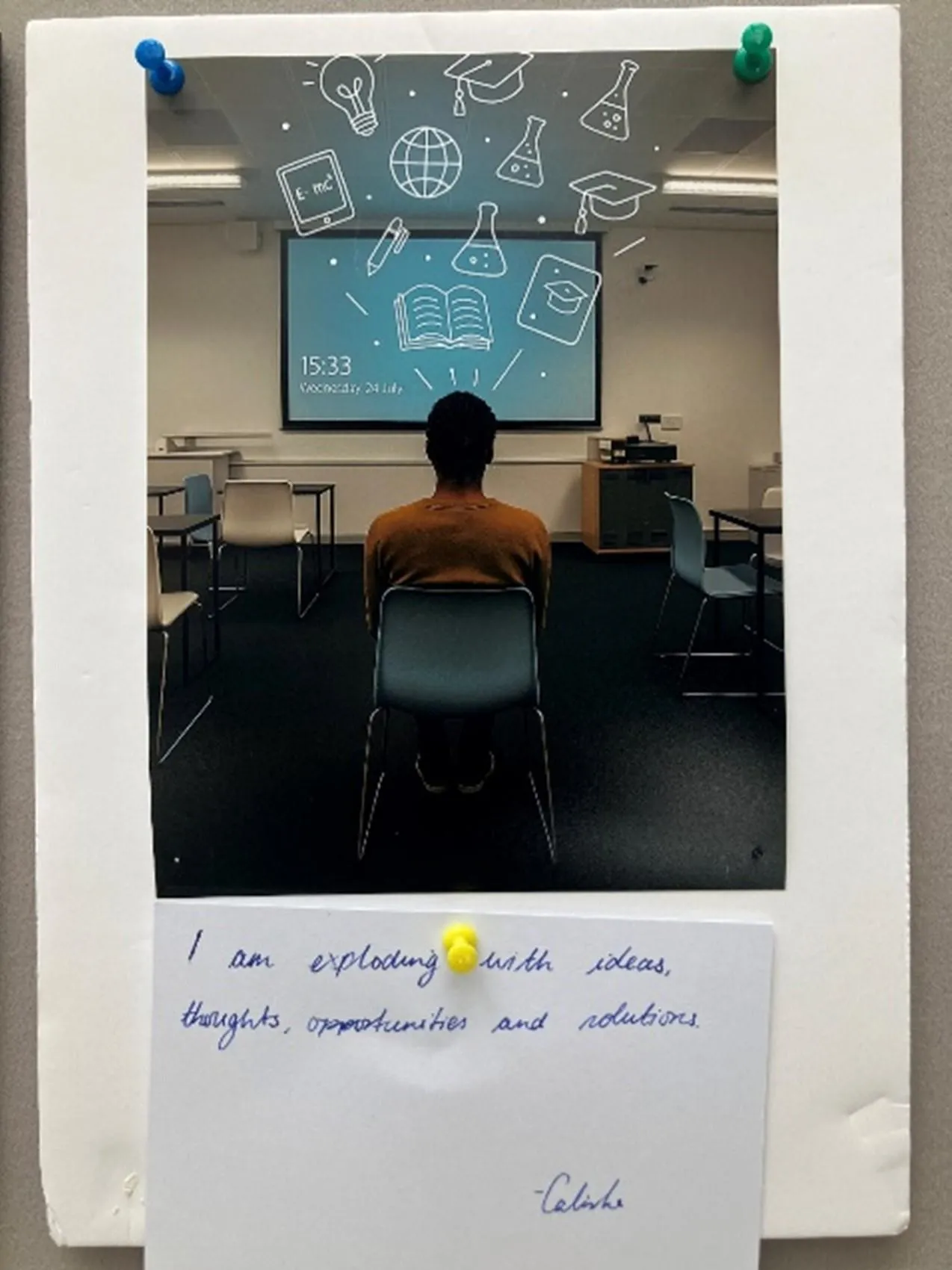 Person seated in seminar room with back to camera and white illustrations representing ideas above head