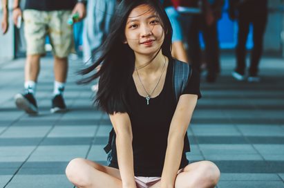 young-woman-sitting-cropped-411x272