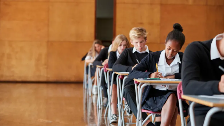 Students taking exams in a hall