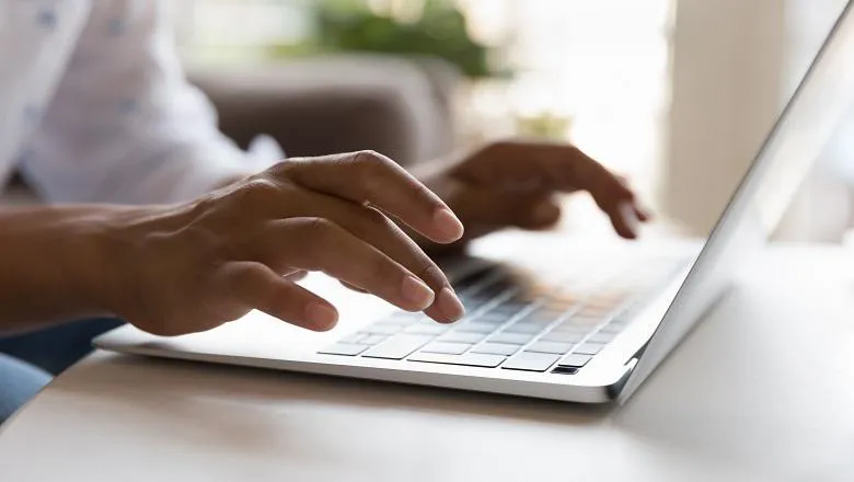 A person typing on a computer