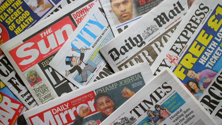 Scattered UK newspapers filling image
