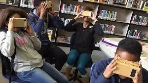 Children wearing virtual reality glasses