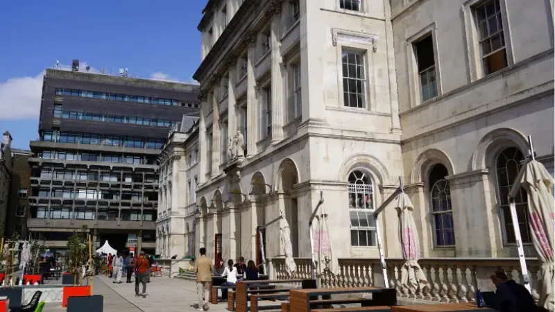 King's building with students walking around campus