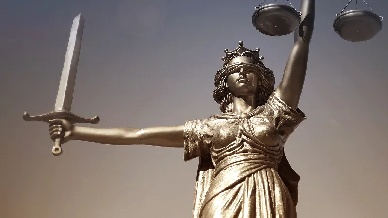 Statue of Lady Justice holding a sword and scales
