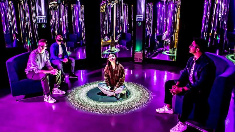 Young people inside a purple lit room in a Science Gallery London exhibition.