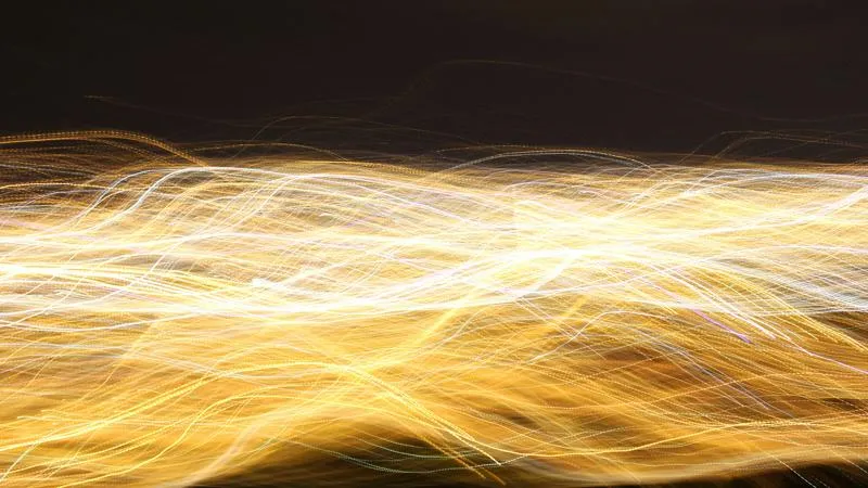 Abstract timelapsed image of waves of yellow light