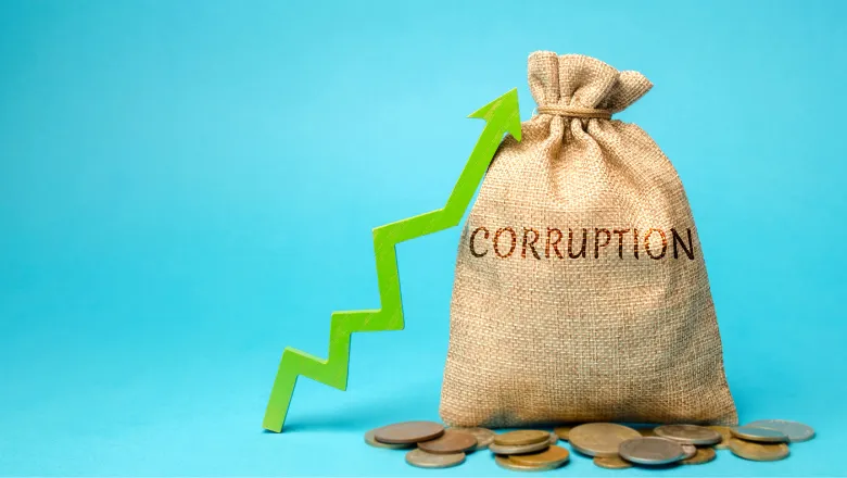 Bag of money with the word corruption written on it with a green arrow indicating an upward trajectory.