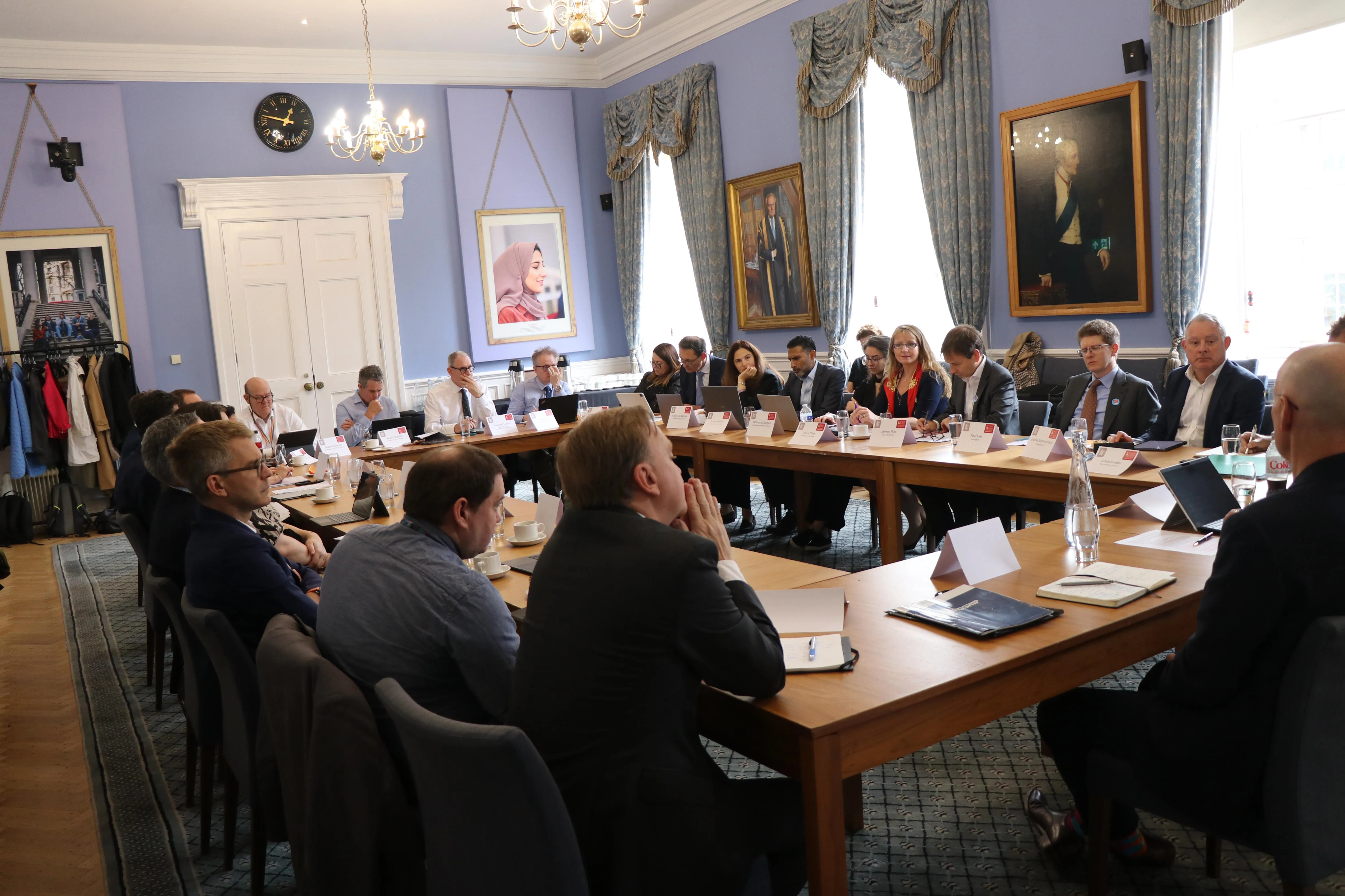 Global investor stewardship conference - a group of people sitting around a table