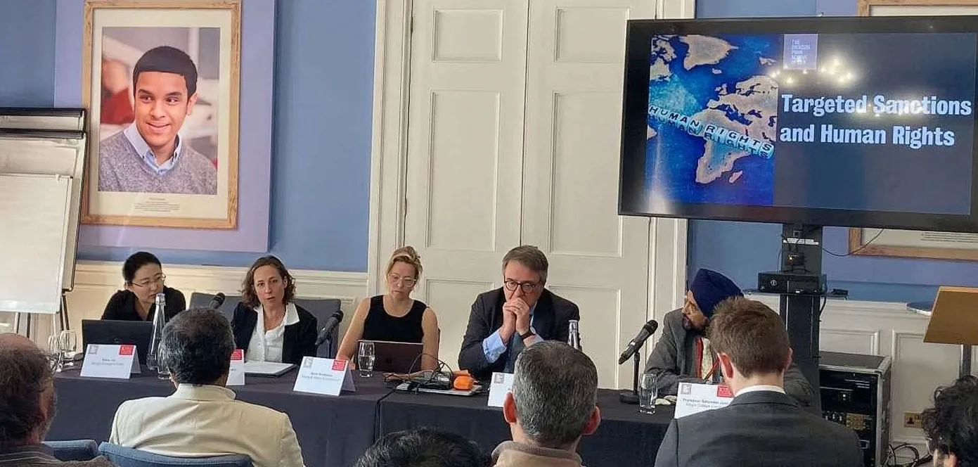 panellists at a table during an event