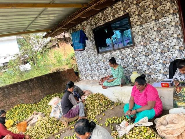 Women seated and working. 