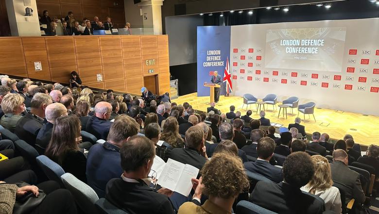 Audience looking at man talking at event