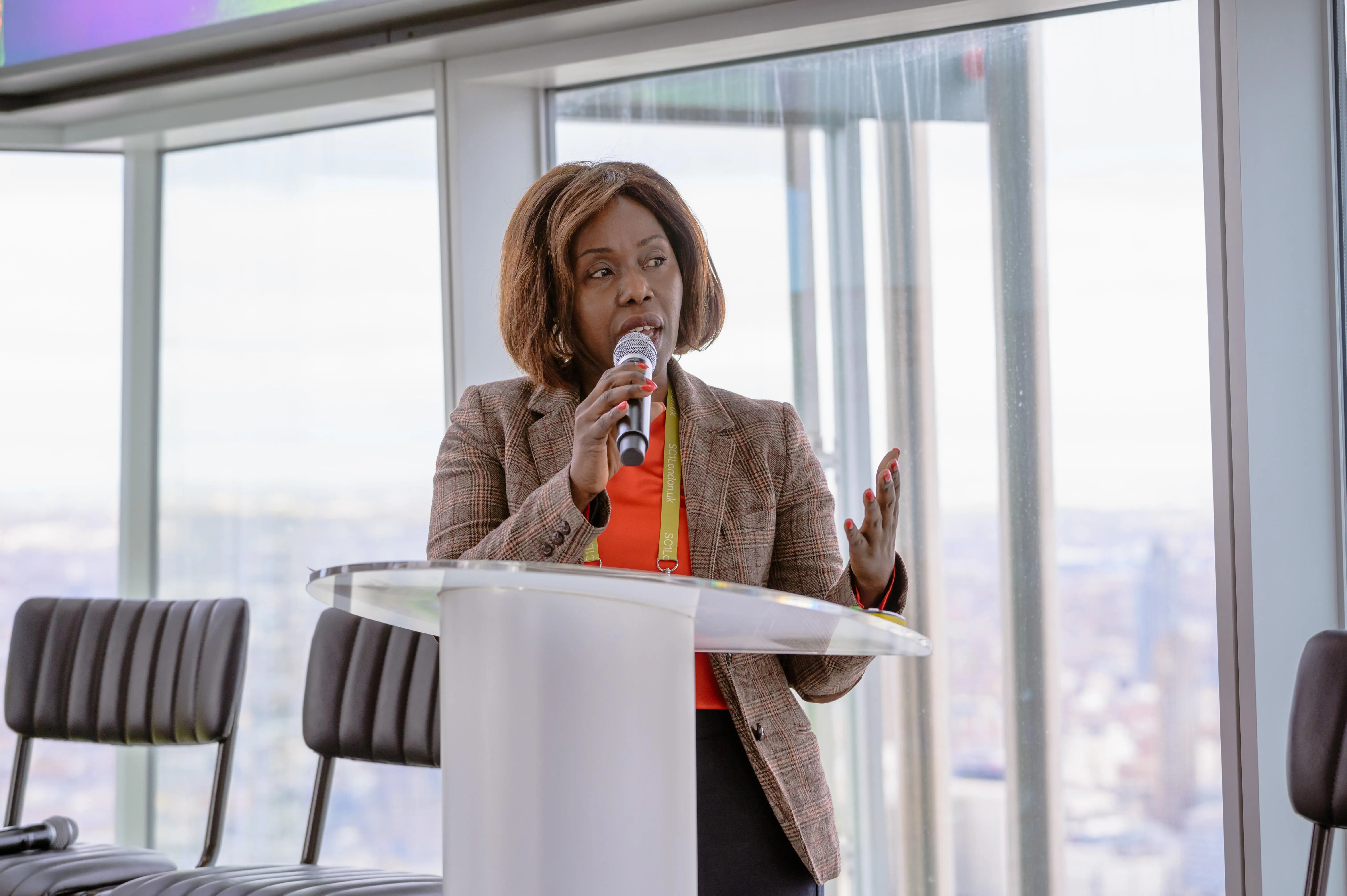 Cllr Evelyn Akoto, Cabinet Member for Health & Wellbeing, speaks at a podium