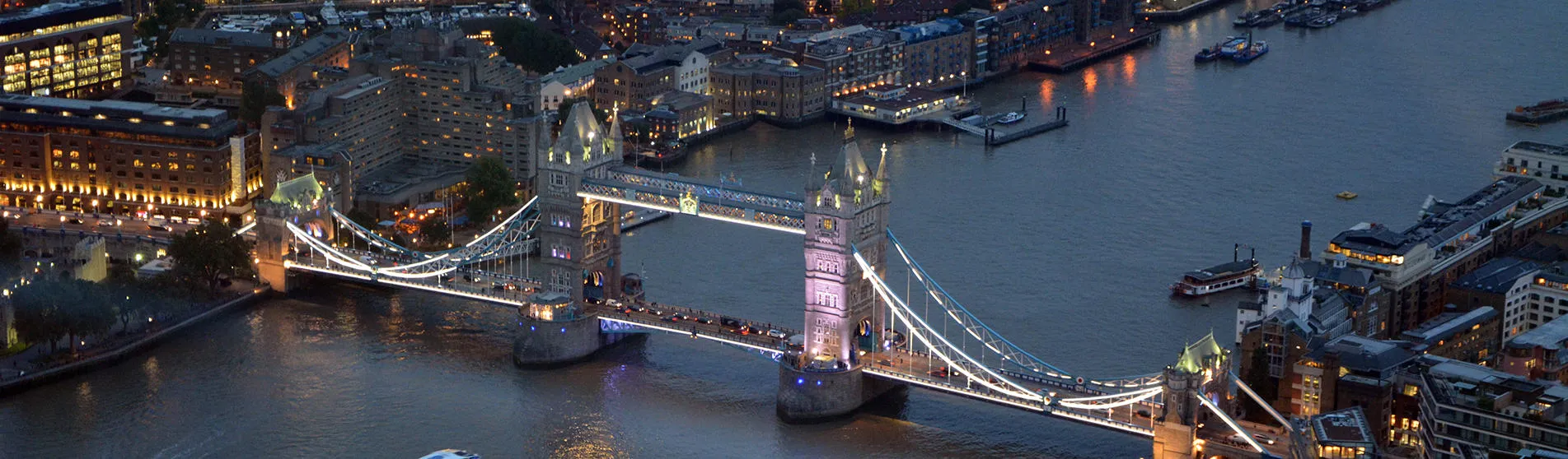 1908x558_aerial-tower-bridge-evening