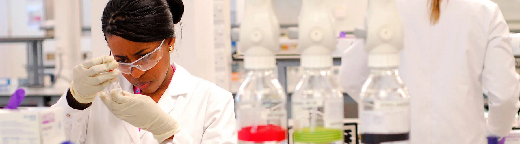 A woman conducts lab testing