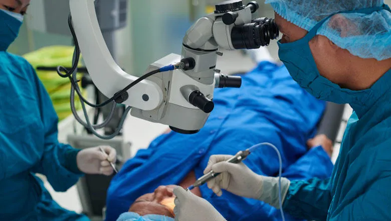 A doctor performs surgery using robotic assistance