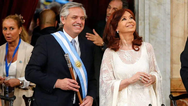 Argentine President Fernandez and Vice-President Fernandez de Kirchner stand smiling