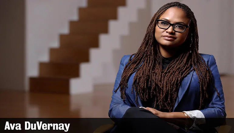 Ava DuVernay sat with a blue jacket