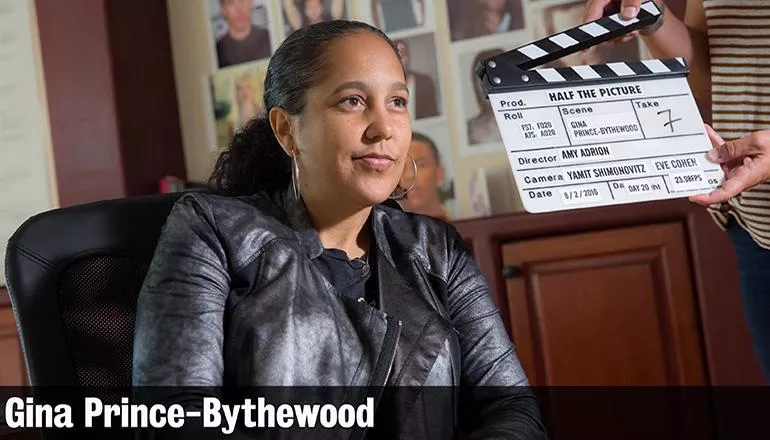 Gina Prince-Bythewood with director's clapboard