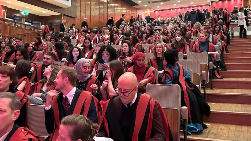 students sitting down in royal festival hall