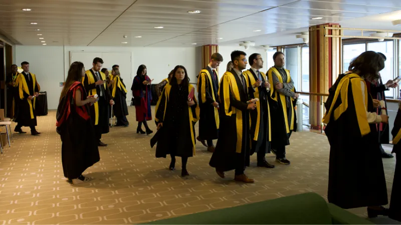 Graduates walking out of the theatre